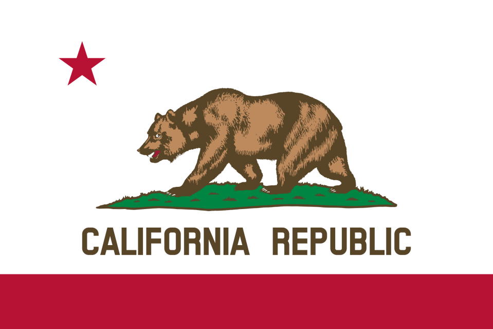 California state flag with grizzly bear above California Republic on white background with red stripe and red star.