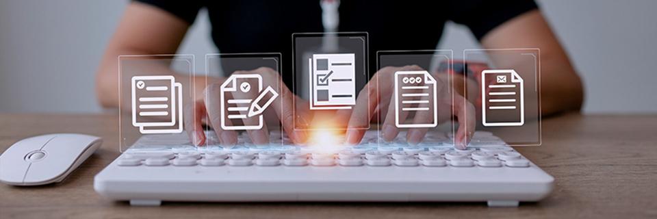 An EB-5 investor typing on a keyboard with visa application icons above it.