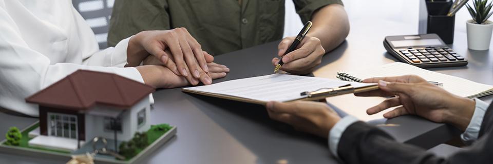 A principal borrower and a lender signing eb5 unsecured loan documents.