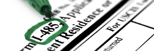 A close-up of Form I-485, Application to Register Permanent Residence or Adjust Status.