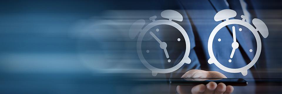 Icons of alarm clocks above an EB-5 investor's hand, symbolizing Form I-485 processing times.