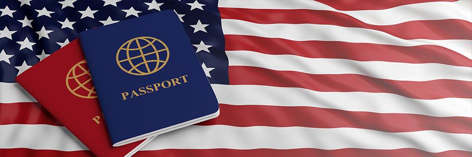 Two passports on an United States flag.