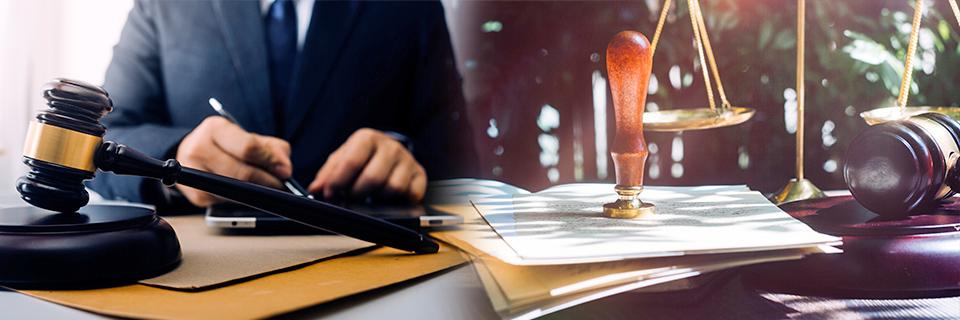 A judge or lawyer at a desk with a mallet and law items, with documents regarding mandamus USCIS lawsuits.