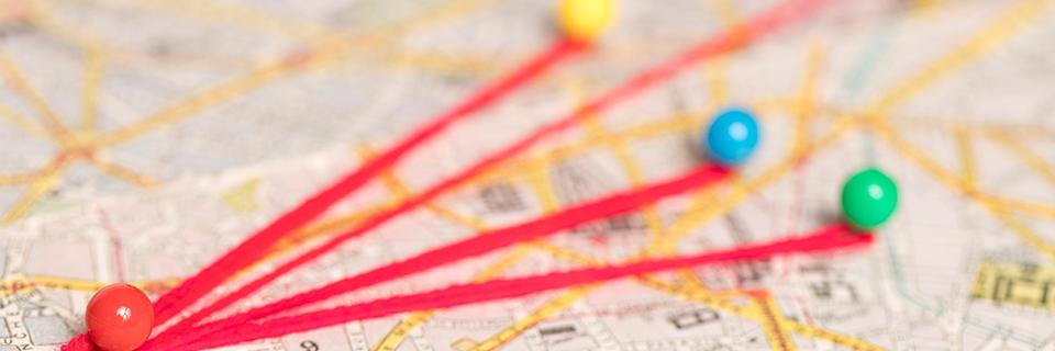 A close up of a map with pins, showing rural areas designated by a governmental entity.