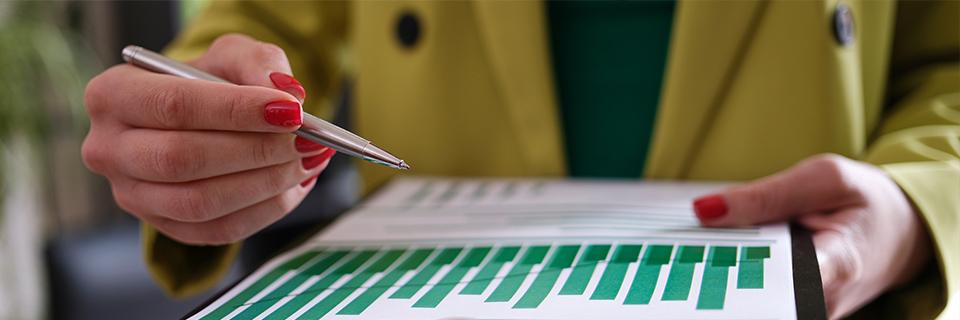 An EB-5 investor examining business graphics as part of the due diligence process.