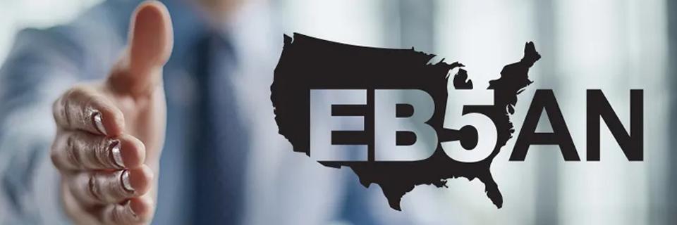 A person reaching out for a hand shake, with the EB5AN logo on the side.