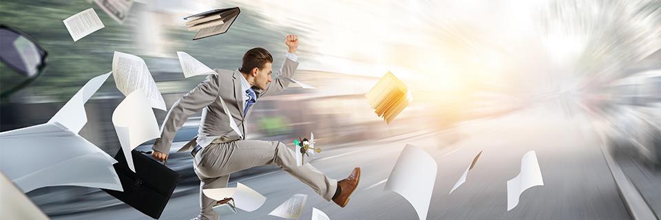 An immigration attorney running in the air with funds documentation flying around on a street.