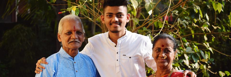 An Indian EB-5 investor and family member looking at the camera.