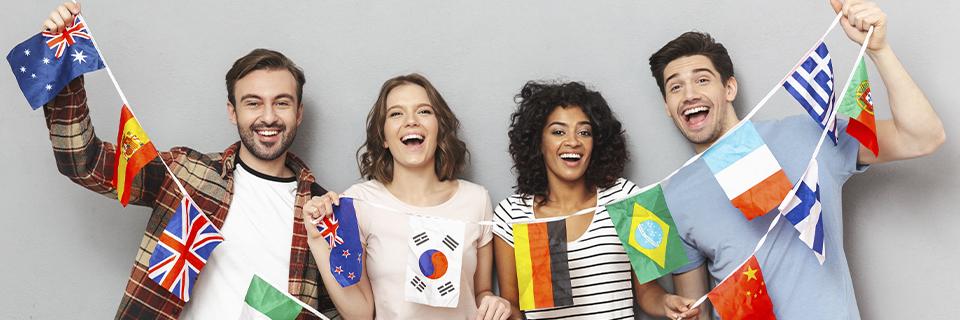 A group of people holding up flags of various countries.
