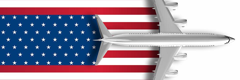 A plane on an image of the American flag.
