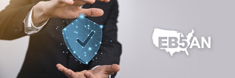 A person holding a digital shield icon next to the EB5AN logo, symbolizing safe EB-5 projects.