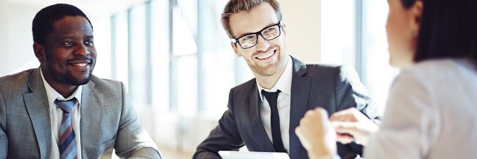 EB5 immigration attorneys explaining the form I-526 to a foreign national.