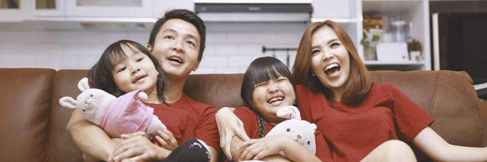 A family of EB5 investors with two children, having fun.