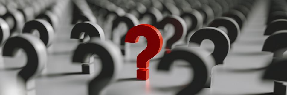 A group of black question marks, with a red one in the center.