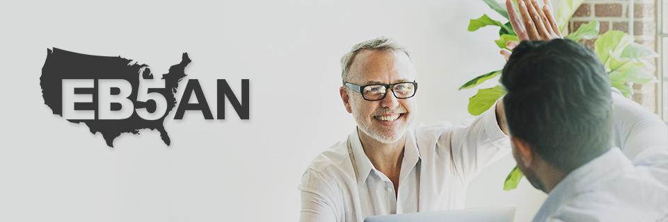 The EB5AN logo next to an EB5 investor giving a regional center managing partner a high five.