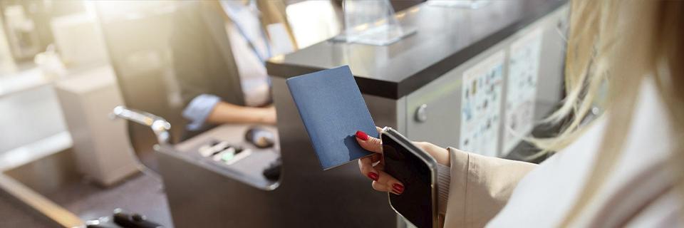 An EB5 investor holding a passport and applying for an immigrant visa or a green card.