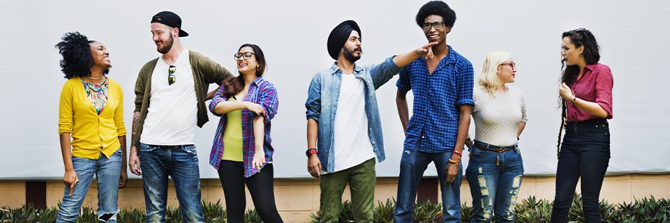 A diverse group of U.S. citizens and an Indian EB5 investor posing together.