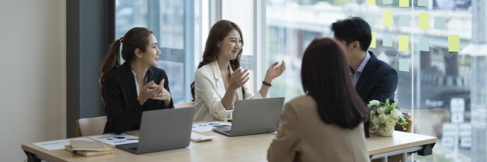 A collaborative meeting among investors and project managers, underscoring the significance of open communication in the EB5 process.