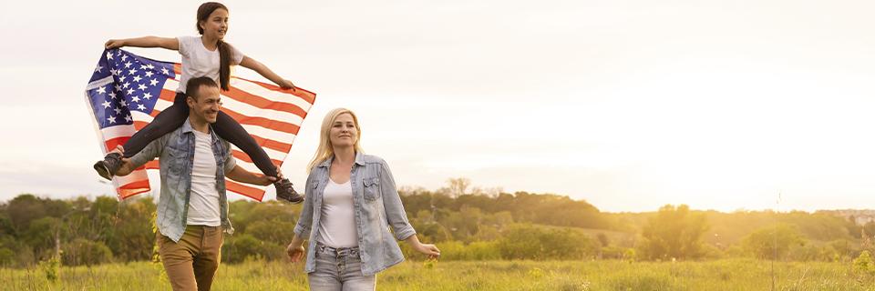 A happy immigrant family celebrating U.S. residency, symbolizing the American Dream through the EB5 visa program.
