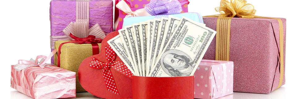 A collection of colorful gift boxes with U.S. dollar bills inside, illustrating the importance of proving the validity of gifted funds in EB5 investment applications under USCIS guidelines.