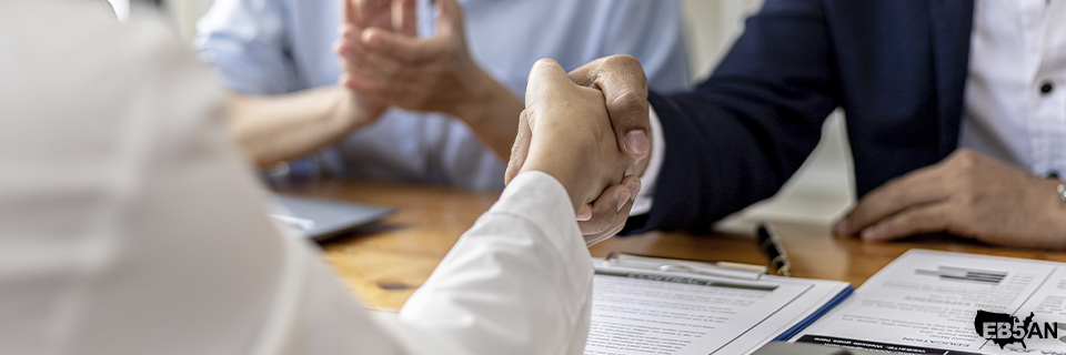 Investor finalizing agreement with EB5AN regional center representative for a vetted EB5 project offering strong repayment potential.