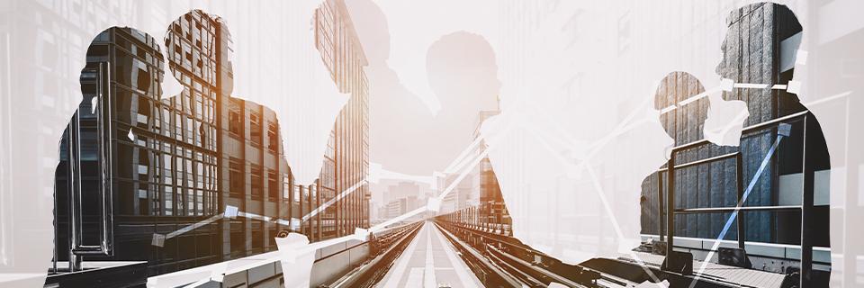 Silhouettes of business professionals in an urban environment, symbolizing global entrepreneurs expanding into the U.S. market through EB5 investment