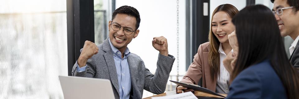 Happy investors celebrating EB5 project success, symbolizing strong business outcomes and job creation in the U.S.