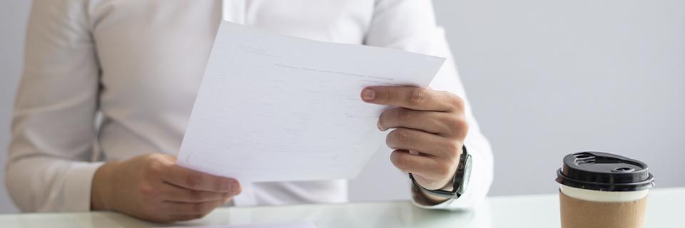 Investor reviewing EB5 immigration documents at a desk, illustrating the preparation process for concurrent filing.