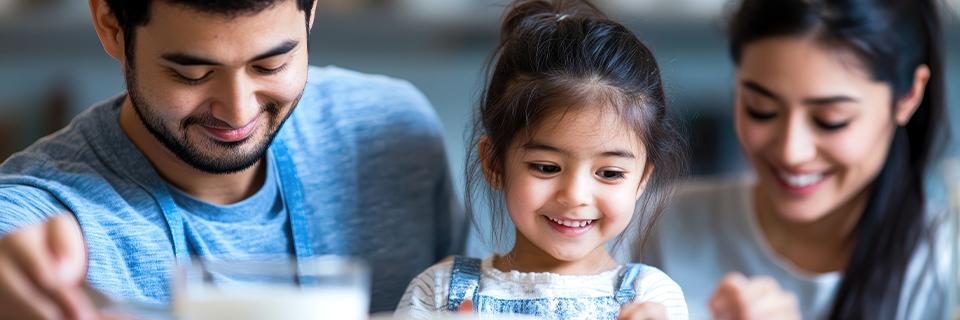 Young Indian family sharing a meal together, representing how EB5 can help secure U.S. residency and stability for spouses and children.