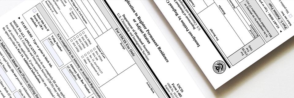 USCIS Form I-485 and other immigration forms, representing the concurrent filing process for EB5 applicants.
