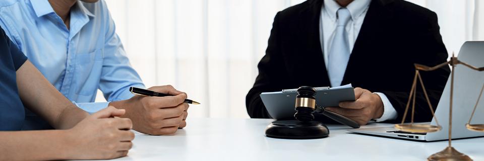 Immigration attorney meeting with EB5 investors, providing guidance on age-out rules and the Child Status Protection Act to protect dependent eligibility.