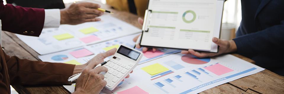 Team reviewing job creation models, economic forecasts, and fund allocation to ensure EB5 project compliance and avoid RFEs.