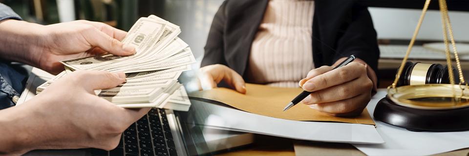 Investor counting U.S. dollars next to legal documents and scales of justice, symbolizing EB5 source of funds and compliance with USCIS requirements.