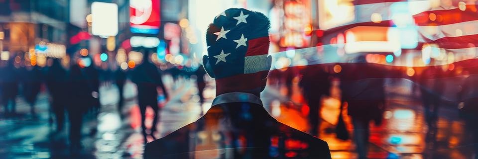 A professional looking at a city skyline with an American flag overlay, representing EB5 investors building futures in the United States