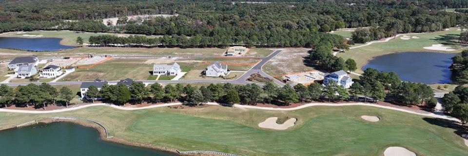 Aerial view of the Bay Creek EB5 project and golf course, showing active home construction in a rural setting, symbolizing EB5 rural project development.