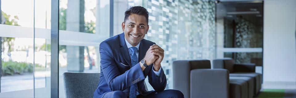 A business professional in a modern office setting, symbolizing skilled foreign workers exploring EB5 and alternative U.S. work visa pathways.